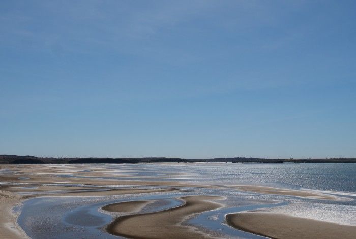 Shot of low tide sand on sunny day