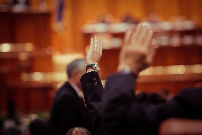 a generic image of a raised hand in the air