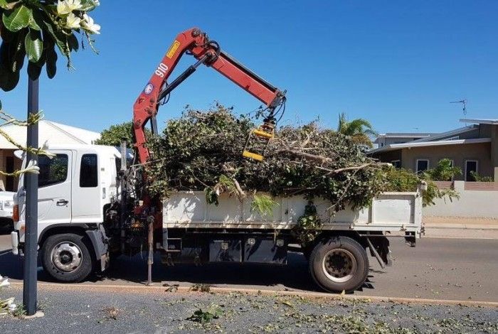 truck removing green waste away to a waste facility 