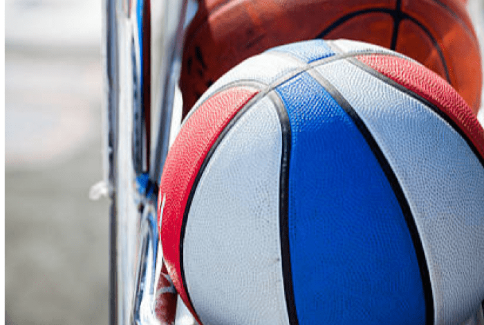 close up of basketballs on a stand 