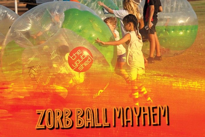 youth playing with zorb balls