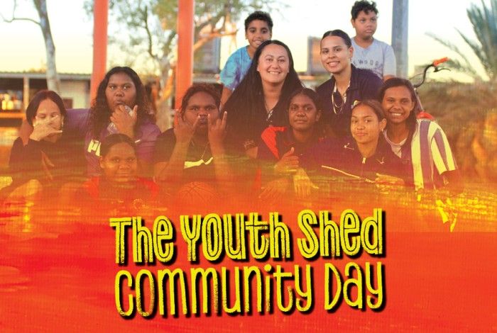 image of youth shed staff and youth smiling at the camera