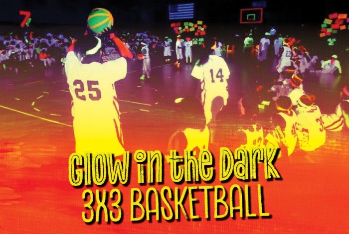 picture of people playing basketball in glow in the dark outfits