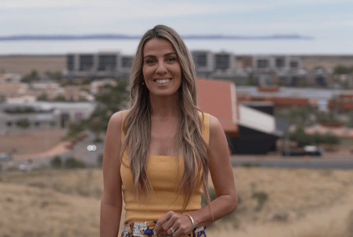 THe Our Town host standing at the tank hill lookout