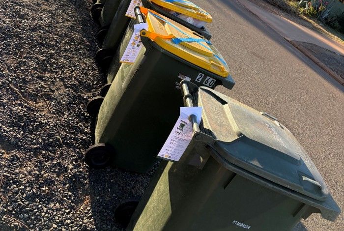 a line of bins that have been tagged